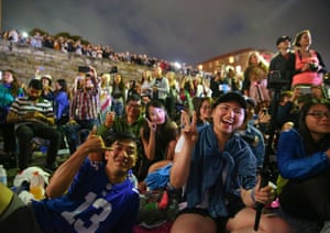 Crowds watch the Family Fireworks from McMahons Point in Sydney