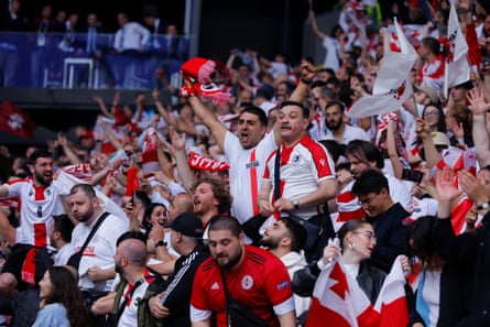Georgia’s fans celebrate after Georges Mikautadze’s equaliser.