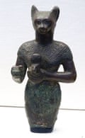 Upper portion of a bronze figure of Bastet holding a cat aegis. From the late period. Dated 600 BC.