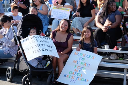 Woman holds up sign at naval base