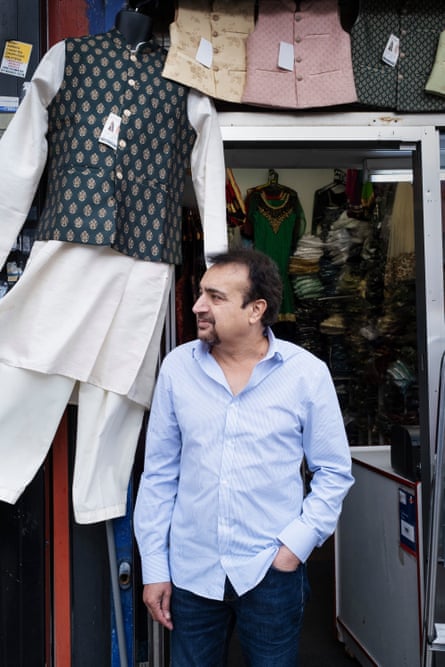 Ankush Puri stands outside his shop