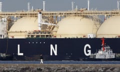 Images of LNG Tankers and Container Ships As Japan Releases Trade Number<br>A man walks past the Shahamah liquefied natural gas (LNG) tanker sitting berthed at Tokyo Electric Power Co.’s (Tepco) Futtsu gas-fired thermal power plant in Futtsu Chiba Prefecture, Japan, on Thursday, Jan. 21, 2016. The Ministry of Finance is scheduled to release Japan’s fuel trading data on Jan. 25. Photographer: Tomohiro Ohsumi/Bloomberg via Getty Images