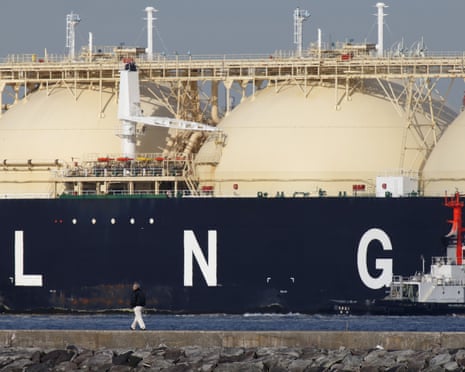 Images of LNG Tankers and Container Ships As Japan Releases Trade Number<br>A man walks past the Shahamah liquefied natural gas (LNG) tanker sitting berthed at Tokyo Electric Power Co.’s (Tepco) Futtsu gas-fired thermal power plant in Futtsu Chiba Prefecture, Japan, on Thursday, Jan. 21, 2016. The Ministry of Finance is scheduled to release Japan’s fuel trading data on Jan. 25. Photographer: Tomohiro Ohsumi/Bloomberg via Getty Images