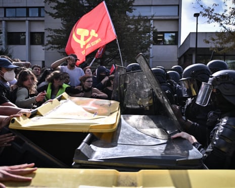 Clashes occur between riot police and demonstrators during a high school students' protest against education conditions in Saint-Denis, north of Paris, France.