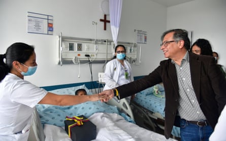Colombia’s president, Gustavo Petro, greets a nurse tending to one of the four Indigenous children who survived an Amazon plane crash.