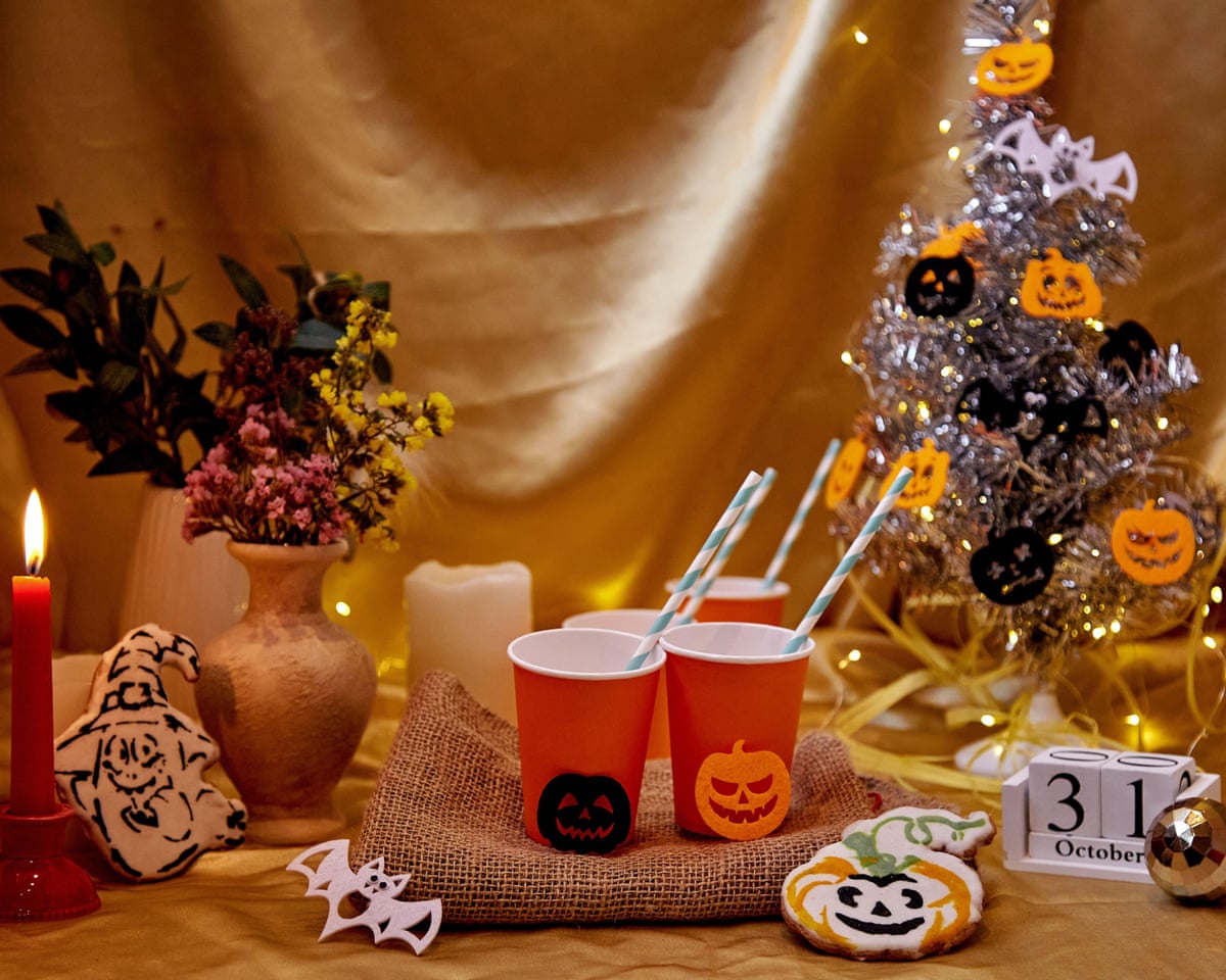 An array of Halloween ornaments and items, including a tinsel tree