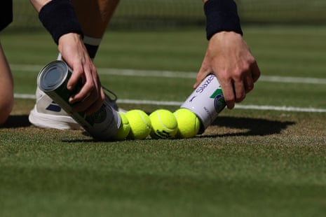 New balls are put out from tubes on the Centre Court at Wimbledon
