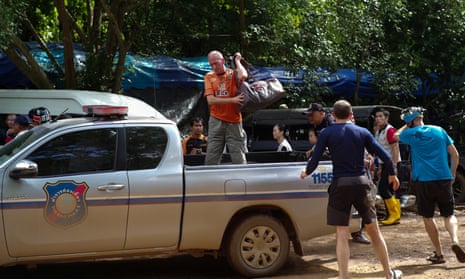 British caver Vernon Unsworth, centre, gets out of pick up truck
