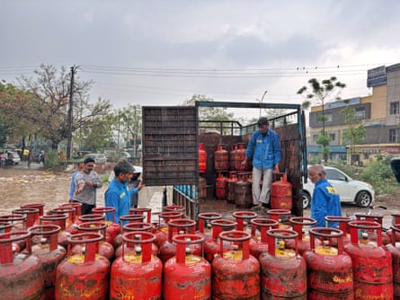 Gas cylinders being distributed to registered consumers in Noida, outside Delhi.