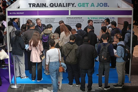 Crowds of mostly young people at a jobs fair.