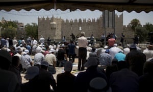 Worshipersprevented from entering the al-Aqsa Mosque gather for Friday prayer outside Jerusalem’s Old City.