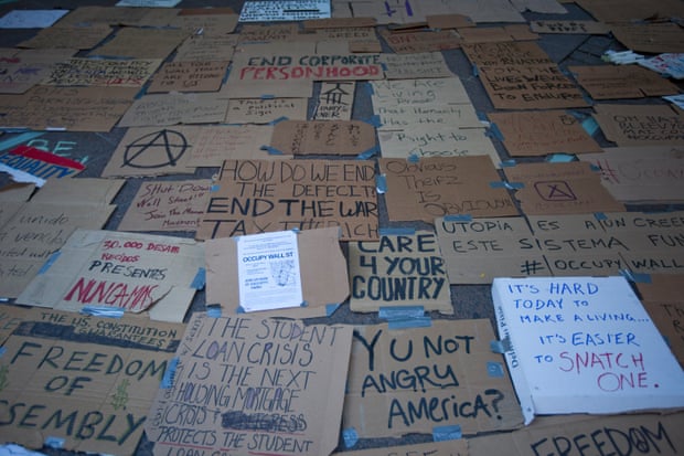 Signs on the floor in Zuccotti Park.