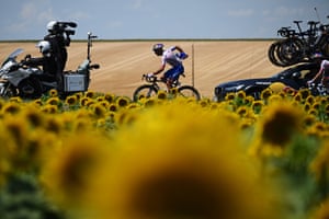 Gianni Moscon of Red Bull–Bora Hansgrohe passes a sunflower field during Stage nine