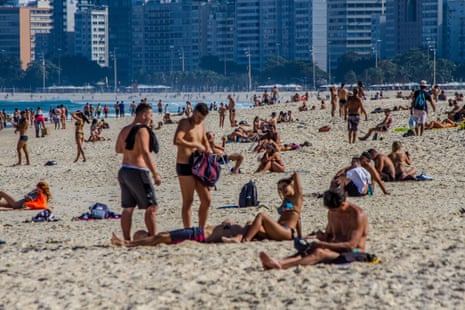 Even with the creation of a fine for bathing in the sea and sitting on the beach sand decreed by the city to stop the spread of coronavirus, bathers frequent Leme beach in Rio de Janeiro on Saturday, 11 July 2020.