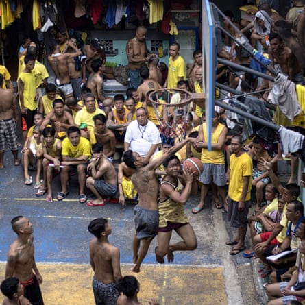 Inmates play basketball in the Quezon City jail in suburban Manila