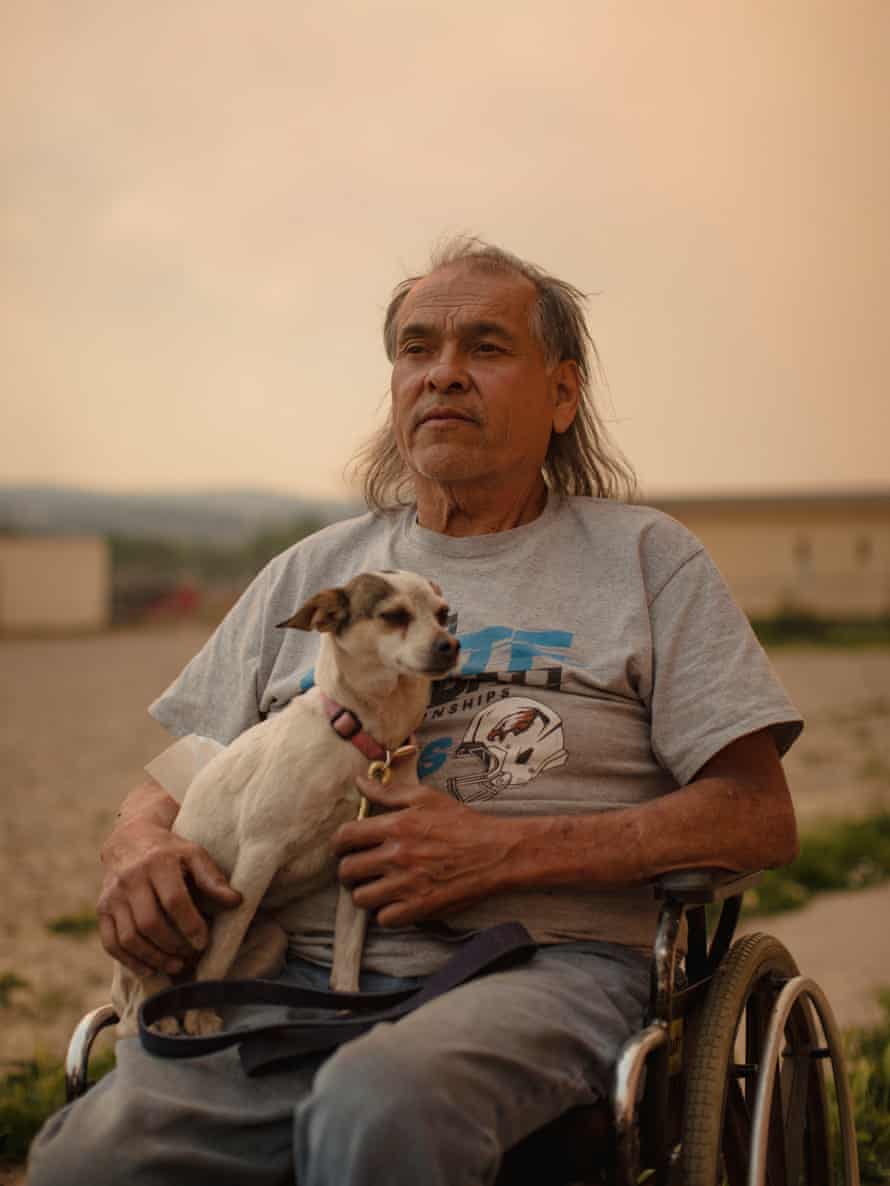 trujillo in wheelchair - dog sits on his lap