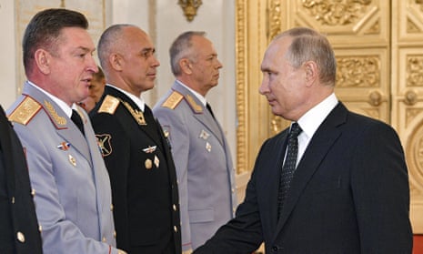 Vladimir Putin, right, and Alexander Lapin, the chief of Russia’s central military district, left, at an awarding ceremony in the Kremlin on 31 May 2018
