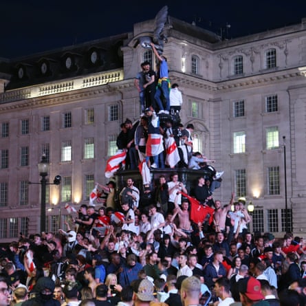 Fans of England celebrate after winning the quarter final match against Ukraine.