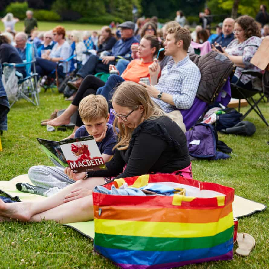 Mother and son read the programme before the show at Waddesdon Manor