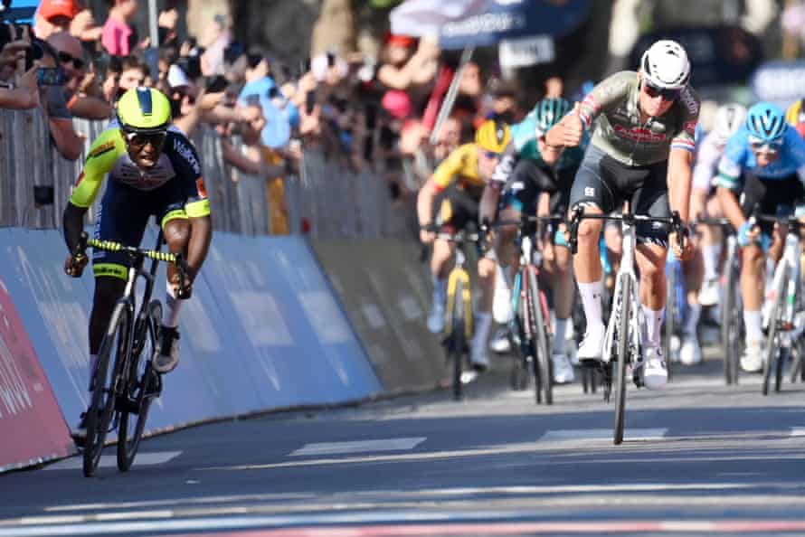 Mathieu van der Poel gives a thumbs up as Biniam Girmay wins.