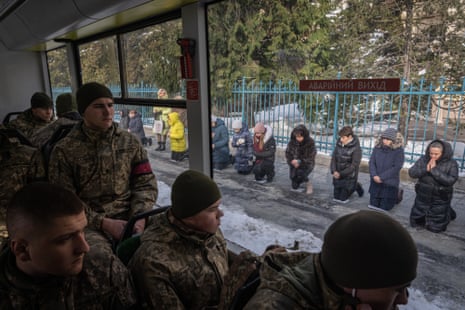 People attend the funeral ceremony of Ukrainian soldiers Bogdan Baran, Mihajlo Popic and Vitaly Fedor, in Lviv.