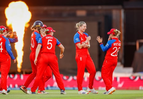 Freya Kemp of England celebrates taking the wicket of Annerie Dercksen of South Africa with teammates.