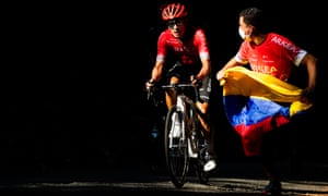 Dayer Quintana of Arkea Samsic is chased by a fan on the Montee de la Selle de Fromentel.