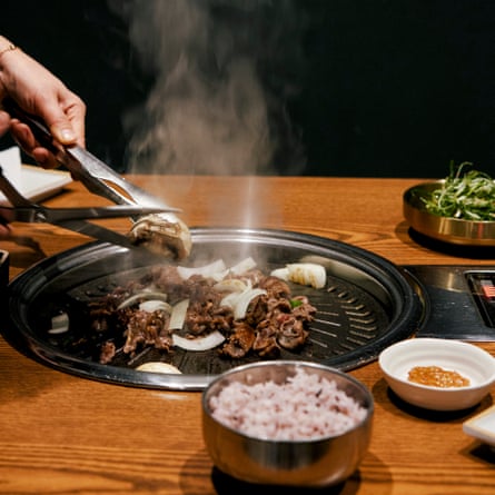 Bulgogi cooking on a hot plate at Cah Chi in New Malden, south-west London
