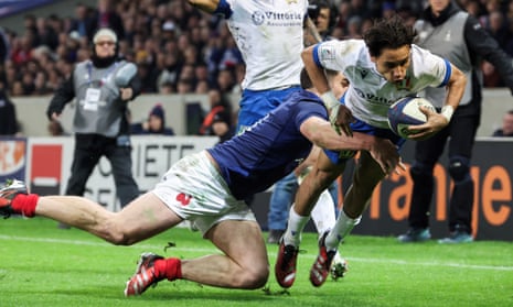 Ange Capuozzo scores a try for Italy against a lacklustre French side in Lille.