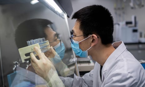 A researcher in Beijing works on an experimental coronavirus vaccine