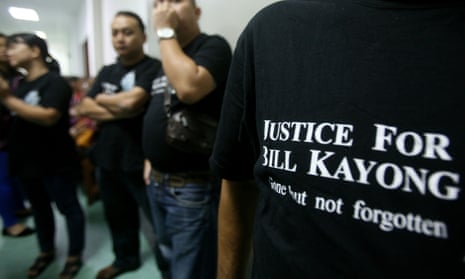 Supporters of Bill Kayong outside the court at the trial of three men charged in his murder