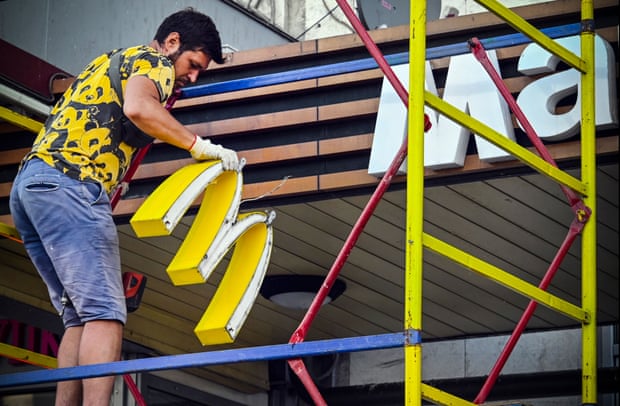 A worker removing McDonald’s logotype from a Moscow restaurant in June.