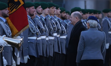 The German chancellor, Olaf Scholz, inspects troops in Berlin, 13 March 2024. 
