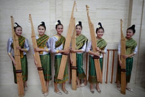 A group of musicians pose with their khaens, a bamboo woodwind instrument, prior to performing at the 28th Association of Southeast Asian Nations summit in Vientiane Laos.