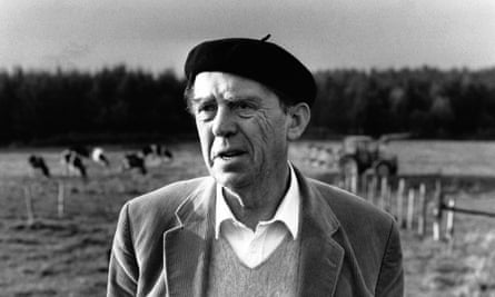 Heinrich Böll wearing a beret in a field of cows