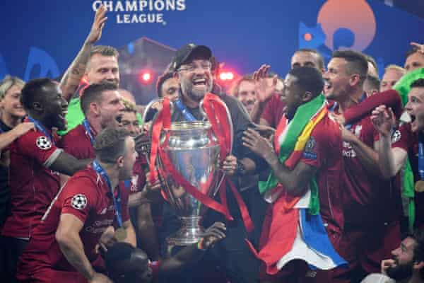 Jürgen Klopp holds the 2019 Champions League trophy after Liverpool beat Tottenham in the final