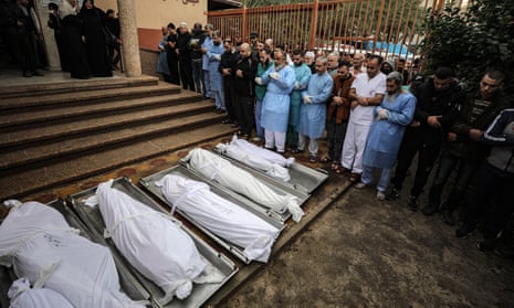 Relatives mourn those killed in the conflict at Nasser hospital in Khan Younis.