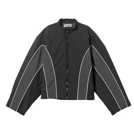 A short black jacket with grey and white stripe detail on a white background