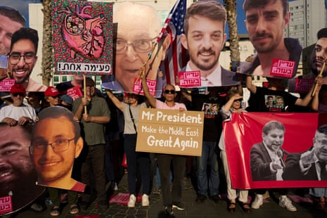 People attend a rally calling for the release of hostages held in the Gaza Strip and urges a ceasefire, in front of the U.S. Embassy branch office in Tel Aviv, Israel, Monday, July 7, 2025, ahead of the planned meeting between U.S. President Donald Trump and Israeli Prime Minister Benjamin Netanyahu. (AP Photo/Oded Balilty)