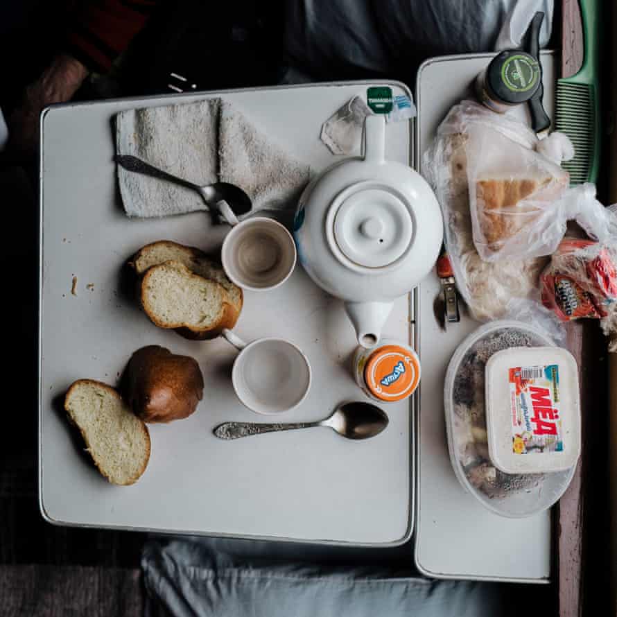 Tupperware, cups and pots  on the small tables.