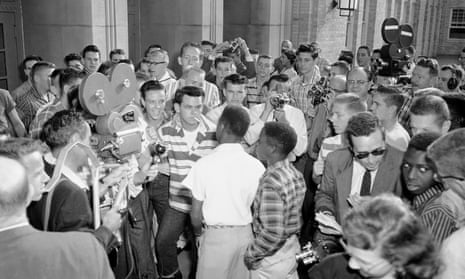 White students at North Little Rock High School block the doors of the school, denying access to six Black students in September 1957. Cowboys owner Jerry Jones is at the back of the crowd