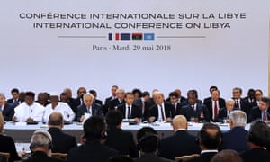Emmanuel Macron, centre, at the Libya conference at the Élysée Palace