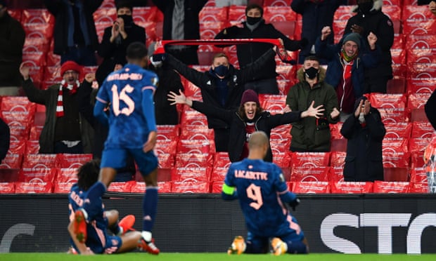 Arsenal’s Alexandre Lacazette celebrates scoring the first goal in front of their fans.