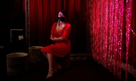Aya Yumiko poses during lockdown in a bar in Kabukicho where she used to perform as a burlesque dancer.