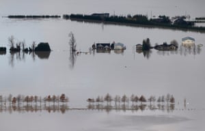 Floodwaters surround homes