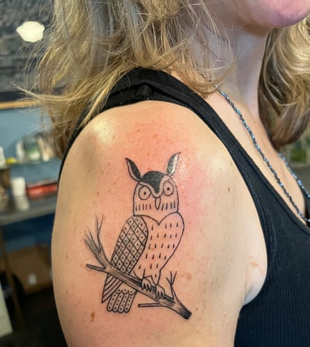 Owl tattoo on woman’s arm