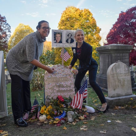 Women place ‘I voted’ stickers on the grave of women’s suffrage leader Susan B Anthony in Rochester, New York.