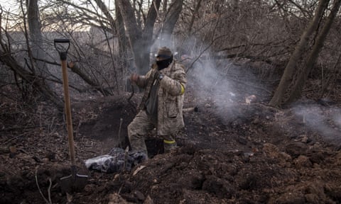 A Ukrainian serviceman is seen in the trenches in the frontline of Bakhmut in Donetsk, Ukraine.