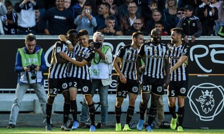 Casimir Ninga (far left) takes the acclaim of his Angers teammates after his decisive impact from the bench.
