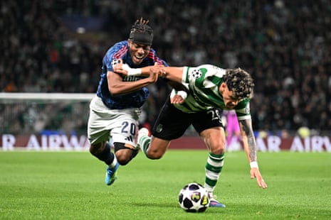 Noni Madueke of Arsenal (left) is fouled by Maximiliano Araujo of Sporting.